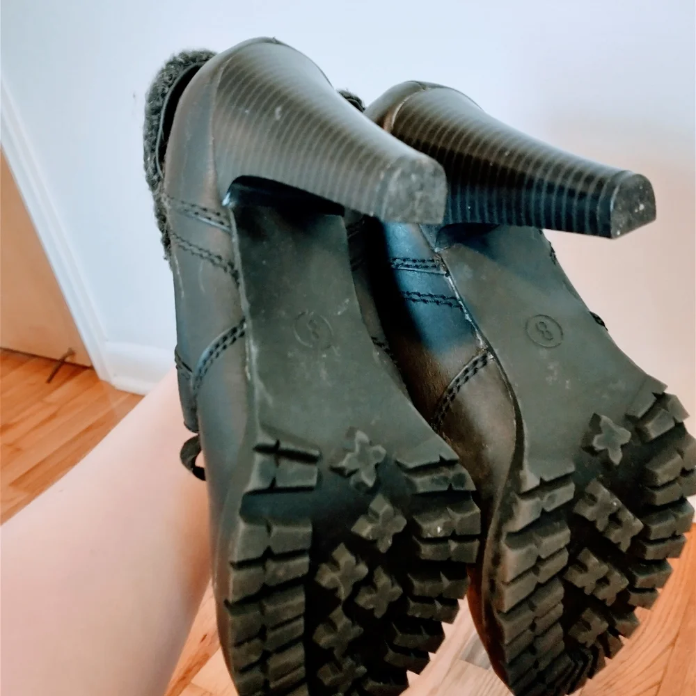 Ankle boots with heel and fur around the ankle.  Minor wear at the heel inside t